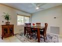 Inviting dining area featuring a wooden table, four chairs, and decorative rug, bathed in natural light at 4300 31St N Ave, St Petersburg, FL 33713