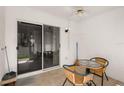Relaxing lanai with tile flooring, ceiling fan and a view of the backyard at 6336 Bayside Key Dr, Tampa, FL 33615