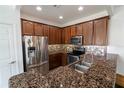 Well-equipped kitchen with stainless steel appliances, granite countertops, and decorative tile backsplash at 6940 47Th N Way, Pinellas Park, FL 33781