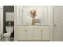 Bright bathroom with a double vanity, granite countertop and decorative vase with floral arrangement at 9414 Gladsome Dr, Land O Lakes, FL 34637