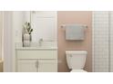This bathroom features a stylish vanity with granite countertop and a shower with tiled walls at 9414 Gladsome Dr, Land O Lakes, FL 34637