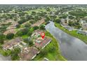 Aerial shot of a residential neighborhood with a nearby lake and golf course at 1012 Radison Lake Ct # 59, Sun City Center, FL 33573