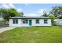 Charming single story home with a well manicured front lawn at 109 Magnolia Ave, Seffner, FL 33584