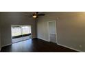 Spacious living room features an attractive fan and sliding glass doors to the patio at 12804 Millridge Forest St, Tampa, FL 33624