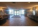 Bright lobby with tiled floors, comfortable seating and decorative lighting fixtures at 2333 Feather Sound Dr # A401, Clearwater, FL 33762