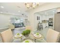 Open floor plan featuring a dining room, living room, and modern kitchen at 3118 Adrian Ave, Largo, FL 33774
