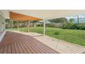 Covered patio overlooks the large backyard, perfect for outdoor entertaining and relaxation at 3118 Adrian Ave, Largo, FL 33774