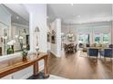Elegant living room featuring hardwood floors, neutral colors, and a seamless flow into the dining area at 3519 Old Course Ln, Valrico, FL 33596