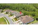 An aerial view of the home showcasing the property's location and surrounding lush green landscape at 4155 Barletta Ct, Wesley Chapel, FL 33543
