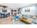 Open-concept living room, dining area, and modern kitchen, with stylish furnishings and ample space at 4900 Brittany S Dr # 611, St Petersburg, FL 33715