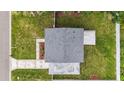 Overhead shot of the house and its surrounding landscape, showing the roof and yard at 4918 Stolls Ave, Tampa, FL 33615