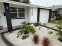 Close-up of well maintained home with nicely landscaped front yard at 539 Freeport N Ave, St Petersburg, FL 33702