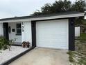 Charming home featuring a single car garage and low maintenance landscaping at 539 Freeport N Ave, St Petersburg, FL 33702