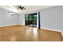 Spacious living room with sliding glass doors to the balcony and natural light at 6361 92Nd N Pl # 1704, Pinellas Park, FL 33782