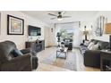 Comfortable living room with a ceiling fan and plenty of natural light at 6630 Spring Flower Dr # 14, New Port Richey, FL 34653