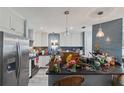 Bright kitchen featuring modern stainless steel appliances and contrasting backsplash at 6645 Freeport Dr, Spring Hill, FL 34608