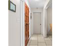 Bright hallway featuring neutral walls and tile flooring at 7276 21St Street N, St Petersburg, FL 33702