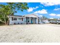 Charming single-story home with a bright blue front door and newly landscaped gravel front yard at 7804 Bracken Dr, Port Richey, FL 34668