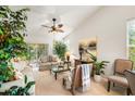 Comfortable living room with natural lighting, ceiling fan, and access to the patio at 9616 Carlsdale Dr, Riverview, FL 33578