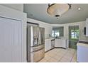 Bright kitchen with stainless steel appliances, white cabinets, and white countertops at 10414 Hallmark Blvd, Riverview, FL 33578