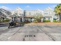 Exterior view of townhomes with parking and landscaping at 2248 Lake Woodberry Cir, Brandon, FL 33510