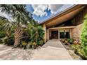 Inviting entrance featuring double doors, brick facade and lovely landscaping at 309 Hidden Lake Dr, Brandon, FL 33511