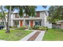 Well-manicured front lawn leads up to the charming home with colorful landscaping at 4206 W North B St # 2, Tampa, FL 33609