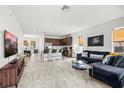 Bright, open-concept living room with tiled floors seamlessly connects to the modern kitchen at 4206 W North B St # 2, Tampa, FL 33609