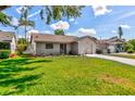 A bright, inviting home with a lovely lawn, an attached garage, and fresh landscaping at 5435 20Th N Ave, St Petersburg, FL 33710