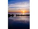 Brilliant sunset view over the bay water at dusk reflecting in the still waters at 6009 Sea Ranch Dr # 306, Hudson, FL 34667