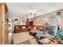Spacious living room with hardwood floors, neutral walls and comfortable seating at 213 Draw Bridge Ln, Valrico, FL 33594