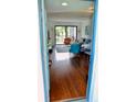 Bright living room with hardwood floors, stylish furnishings, and natural light from sliding glass doors at 2737 Enterprise E Rd # 192, Clearwater, FL 33759