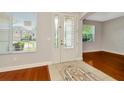 Bright foyer with hardwood floors, and a decorative tile inset at 502 Arch Ridge Loop, Seffner, FL 33584