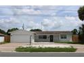 Charming single-story home with attached garage and well-maintained landscaping at 6081 22Nd N Ave, St Petersburg, FL 33710
