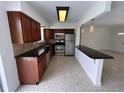Kitchen with stainless steel appliances, granite counters, and tile backsplash at 6081 22Nd N Ave, St Petersburg, FL 33710