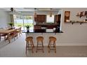 Eat-in kitchen with warm wood cabinets, a breakfast bar, and stainless steel appliances at 6081 22Nd N Ave, St Petersburg, FL 33710