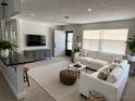 Bright living room featuring modern furnishings, neutral tones, and an open entryway at 6081 22Nd N Ave, St Petersburg, FL 33710