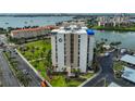 Exterior shot of the condo building, showcasing well-maintained lawns and landscaping around the property at 7400 Sun Island S Dr # 412, South Pasadena, FL 33707