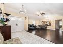 Spacious living room boasting vaulted ceilings, modern light fixtures, and unique flooring at 9220 Mcintosh Rd, Dover, FL 33527