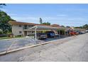Property with convenient covered parking and lush landscaping offers both comfort and curb appeal at 9945 47Th N Ave # 210, St Petersburg, FL 33708
