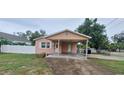 Charming single-story home with a covered carport and well-kept lawn at 1401 43Rd S St, St Petersburg, FL 33711