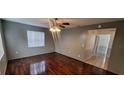 Inviting living room boasts hardwood floors and a classic ceiling fan at 1401 43Rd S St, St Petersburg, FL 33711