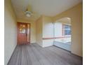 Covered porch with ceiling fan, and decorative front door at 1508 Ingram Dr # 20, Sun City Center, FL 33573