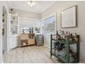 Inviting bar area with unique storage solutions, mini fridge, and stylish bar cart at 1525 38Th N Ave, St Petersburg, FL 33704
