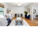 Spacious living room with hardwood floors, modern furniture, and stylish decor with natural light at 1915 10Th N St, St Petersburg, FL 33704