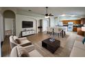 Comfortable living room with a dining area and modern appliances in the background at 25729 Aldus Dr, Land O Lakes, FL 34639