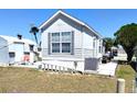 Charming single-Gathering home with a patio area, ladder, and outdoor grill at 35152 Dodie, Zephyrhills, FL 33541