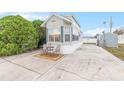 Charming single-Gathering home with an outdoor seating area and mature landscaping at 35152 Dodie, Zephyrhills, FL 33541