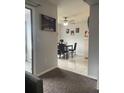 Dining area with tile floor, ceiling fan, table, chairs, and access to the patio at 3802 Cortez Cir # D, Tampa, FL 33614