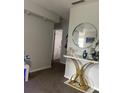 Hallway with mirrored console table and decorative accessories at 3802 Cortez Cir # D, Tampa, FL 33614